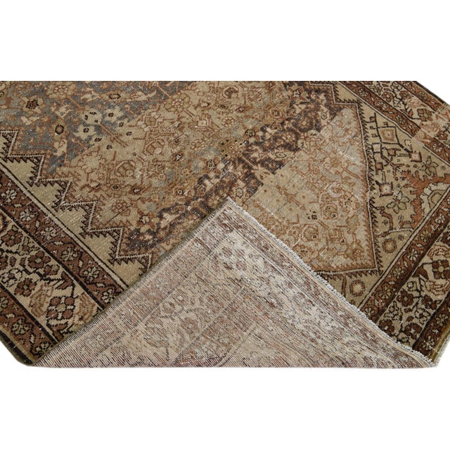 Beautiful antique Malayer hand-knotted wool rug with a gray and beige color field. This Malayer piece has a designed frame...