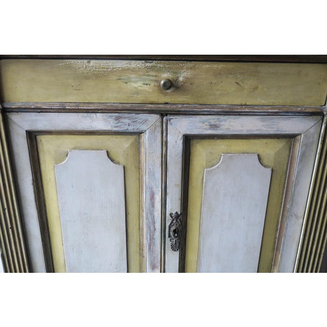 Painted Swedish Gustavian buffet / sideboard dating from about 1780. D-shaped top above two panelled doors with tapering...