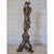 This intricately detailed candleholder is sure to add some whimsical charm to your décor. With a cherub standing on a...
