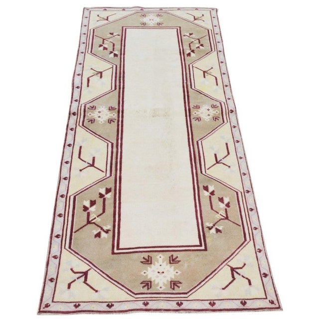 Hand-knotted with care using traditional rug-making techniques, this wool rug blends timeless craftsmanship with a modern...