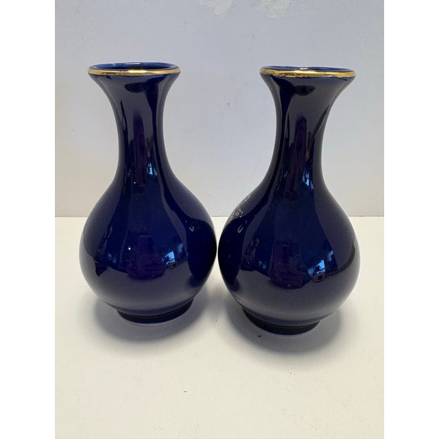 Beautiful matching pair of Kutani Japan bud vases in rich cobalt blue with gold rim and a detailed hand-painted floral &...