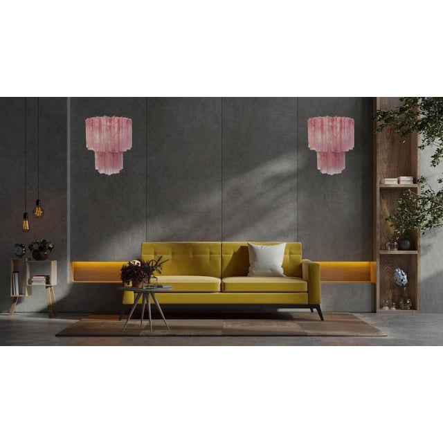 Italian vintage pair of wall sconces in Murano glass and nickel-plated metal structure. The armor polished nickel supports...