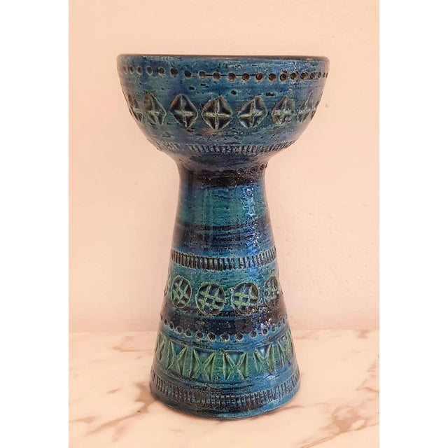 Characteristic relief embossing combines with multi-layered shades of blue to form a serial object that exudes the charm...