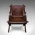This is an antique inscribed Glastonbury chair. An English, oak armchair in Gothic Revival taste, dating to the late...