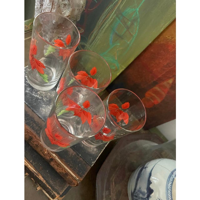 Wonderfully festive set of four glasses, by block in the poinsettia pattern, the colors are vivid and bright, as a red...