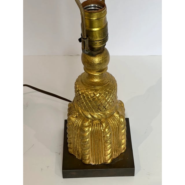 Carved gold wood tassel on small square plinth. This reminds me of classic Elsie De Wolfe. The lamp works well and wiring...