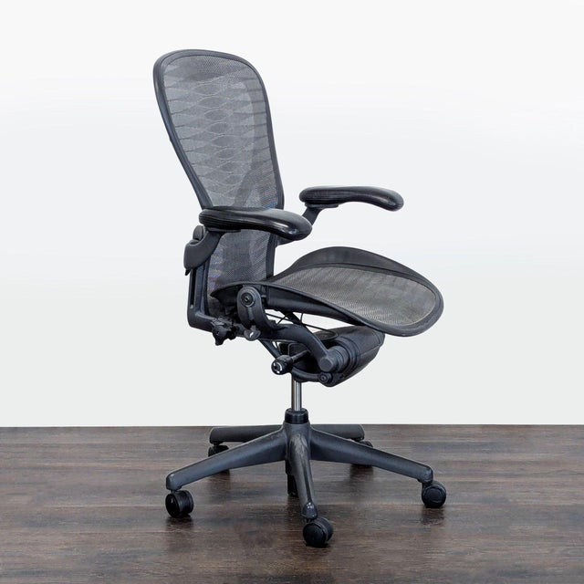This Herman Miller Aeron chair offers excellent comfort and support for long hours at your desk. It features a breathable...