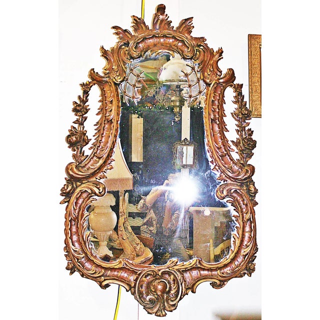 Mid-19th century fully-carved French walnut rococo wall mirror. Original diamond-dust glass, slight gilding accents,...