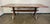 A beautifully worn, handcrafted trestle dining table with timeless rustic appeal, dating to the mid-20th century. The...