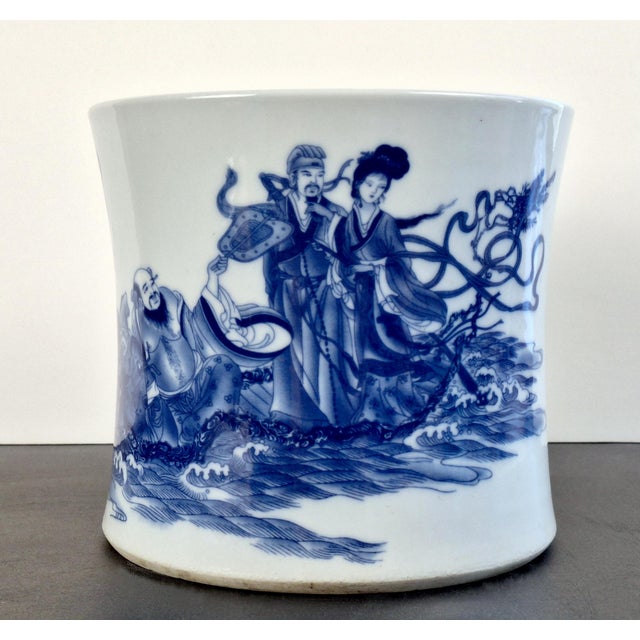 Chinese porcelain Ba Xian Guo Hai bitong , a finely formed brush pot with gently sloping sides, a white glazed interior...