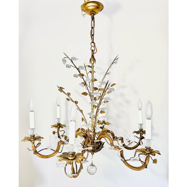 Inspired by a 1940s design found in France, the pairing of glass and pressed steel leaves is exquisite and the faceted...