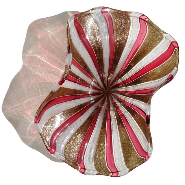 Beautiful vintage Murano hand blown alternating ribbons Italian art glass decorative footed bowl. The piece has a pinched...