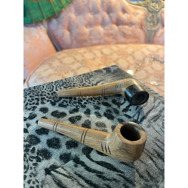 Up for consideration is a beautiful vintage pair of wooden Dominican pipes. These would look lovely in your home and they...