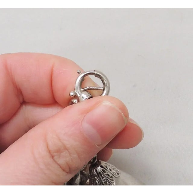 This is part of Chairish’s Costume Jewelry assortment. Rhodium plated Floretine finish bell charm with a faceted glass...