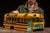 Painted metal salesman sample model of a school bus body, finished in classic yellow with black beltline striping and a...