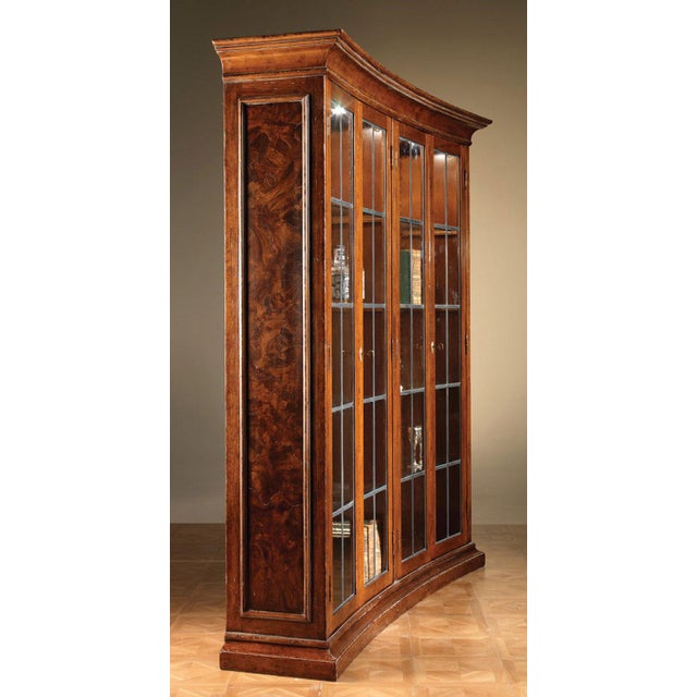 Handcrafted in Italy from solid walnut, this display cabinet features walnut burl veneer side panels and a gently concave...