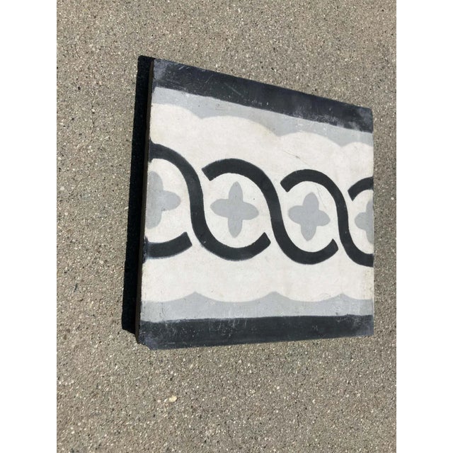 Moroccan handcrafted and hand painted cement tile with modern black, white and grey design. These are authentic Moroccan...