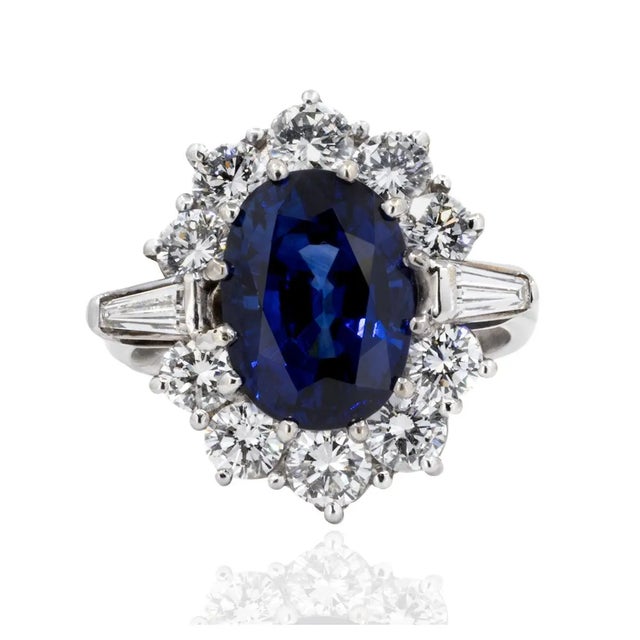 18k White gold ring with 6.37 carat royal blue sapphire weighing 6.37 carats and 2.21 carats of fine diamonds. 8.02 grams