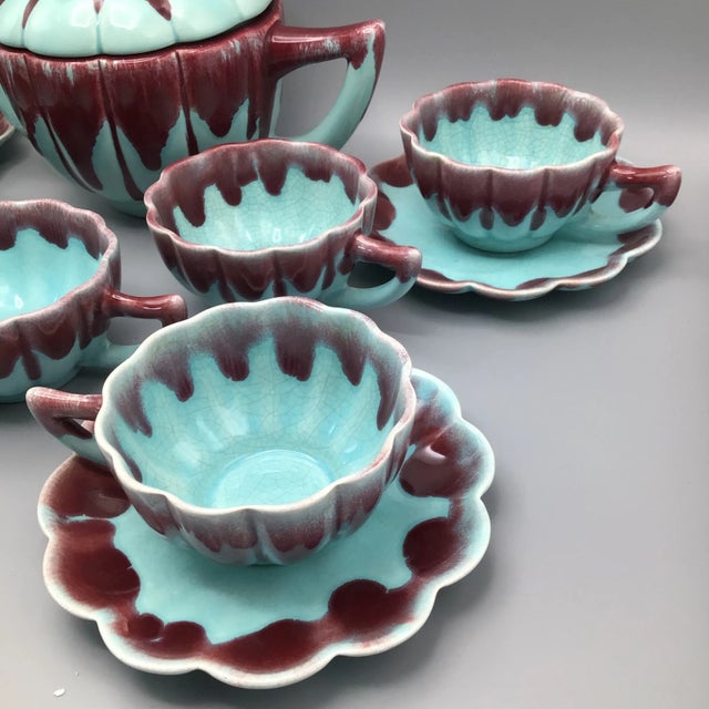 This set of Allen’s of California blue with a burgundy drip pattern comes with the rare teapot. The tea set includes 1...