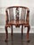 Dimensions: 22.625w × 21d × 31.75h Hand carved chair of solid wood and self jointed wood construction. Unique carvings...