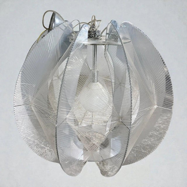 The Paul Secon ceiling light is an extra large pendant designed to transform any space with its mid century lighting charm...