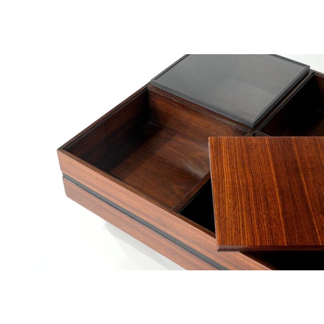 Wooden coffee table with a reversible wooden top that can be used as a serving tray and a glass top. These can be...
