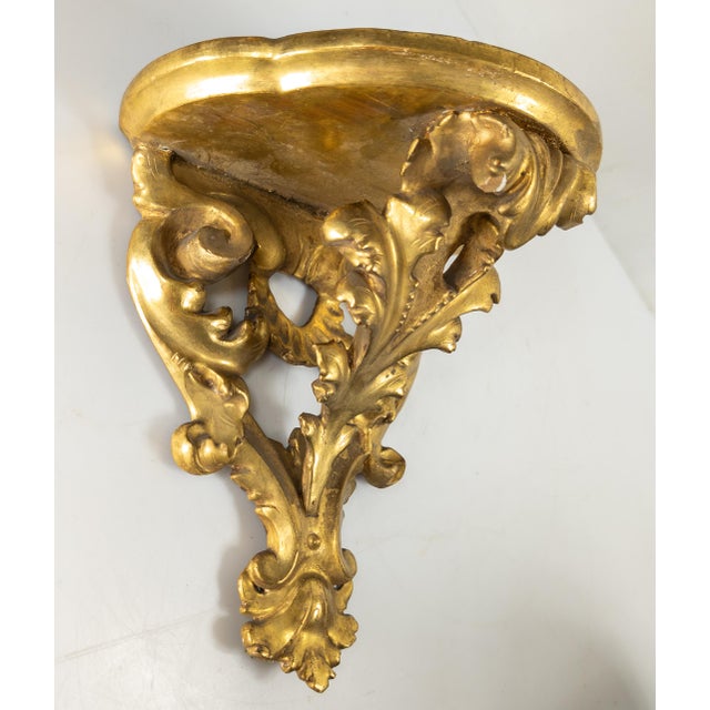 We are selling this great looking Italian Florentine wall shelf. This well carved wood shelf has floral scrolls and...