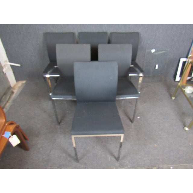 Beautiful set of sleek chrome and black fabric dining chairs from the Italian brand IMS SRL. A comfortable padded seat and...