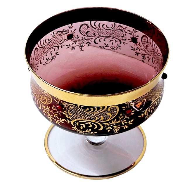 A mid-20th century Murano Venetian art glass dessert bowl handcrafted in Italy. The bowl features deep amethyst glass...