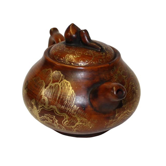 This is an art work display of oriental Chinese teapot which is made of Zisha clay and hand painted with golden color...