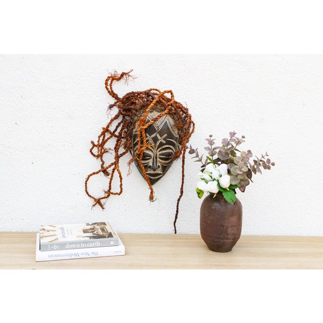 This serene Guro mask from the Ivory Coast is a beautiful example of African tribal art. The mask is characterized by its...