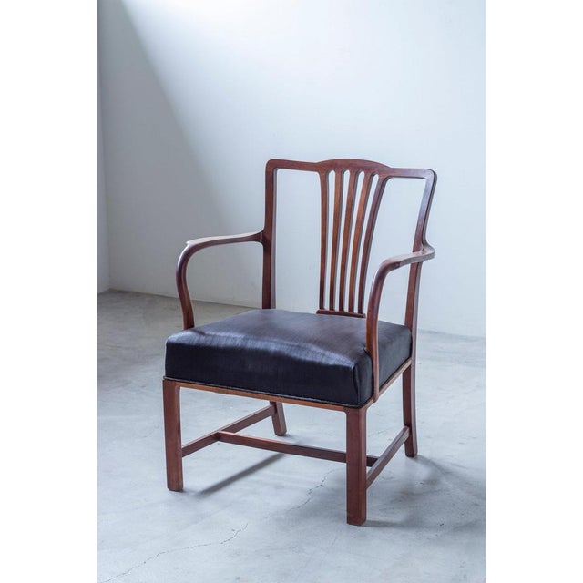 Lounge chair attributed to danish designer ole wanscher. Likely produced by jacob kjaer. Frame made from solid mahogany...