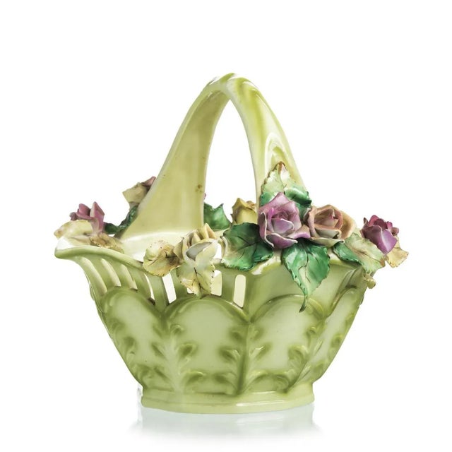 In Vista Alegre porcelain, polychrome decoration with flowers in relief. Defects and faults in the flowers. Mark in use...