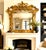 An extraordinary and highly decorative&nbsp;English Rococo carved and giltwood overmantel mirror, distinguished by its...