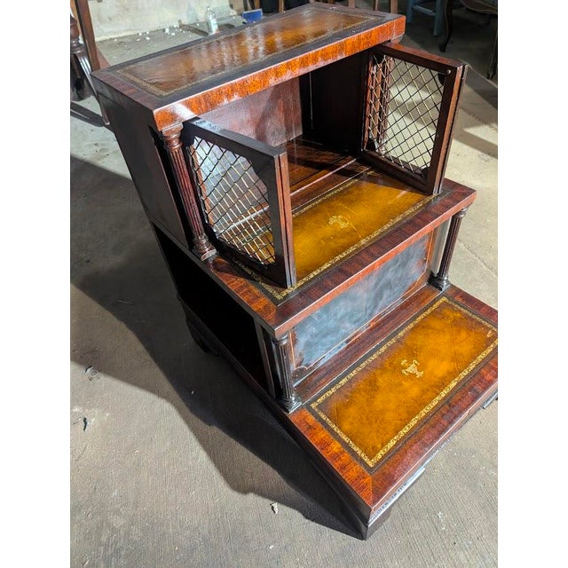 Elegant Regency Mahogany Library Steps Cabinet – Tooled Leather Insets & Brass Grille Doors This exquisite Regency-style...