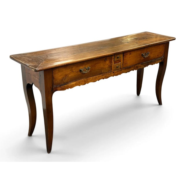 Vintage French country style console or hall table with graceful cabriole legs, an ornamental scalloped apron, and a...