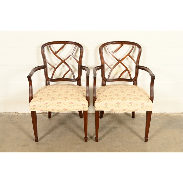A gorgeous pair of Federal or Hepplewhite style armchairs or dining captain chairs In the manner of Kindel Furniture USA,...