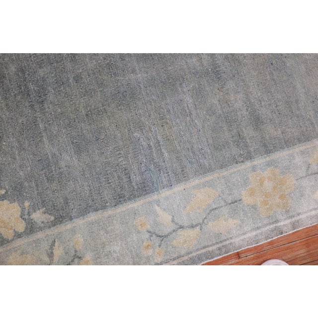 An early 20th-century Chinese Peking scatter-size rug in neutral tones Measures: 3' x 5'9''.