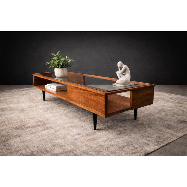 A study in proportion, material intelligence, and quiet architectural clarity, this rare coffee table by Carlo Hauner...