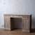 A Regency period mahogany pedestal desk with an unusually shallow depth. Having a bleached finish, three frieze drawers,...