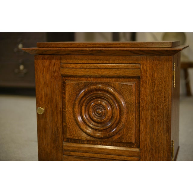 Oak bedside table, 1960s, compact size. It belongs to the neo-rustic movement which, after the war, revived solid oak and...