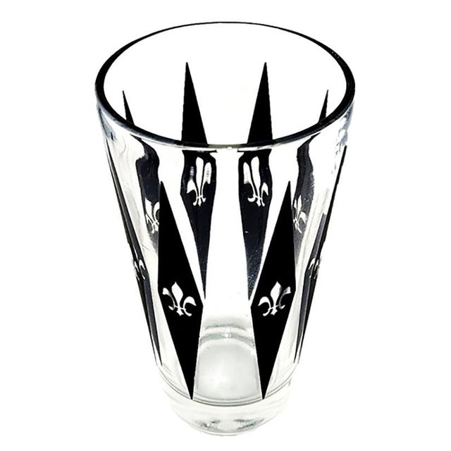 Set of 4 vintage highball glasses feature a distinct harlequin diamond pattern and fleur de lis motif & are attributed to...
