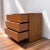 A petite 1960s teak chest with the clean geometry and warm material palette of Danish Modern design. Three broad drawers...
