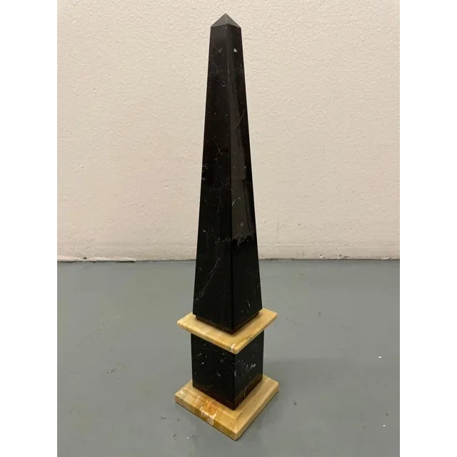 Italian Mid-Century Obelisk in Black and Giallo Siena Marble. 1960s.