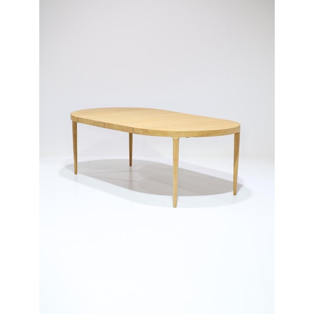 Rare extendable dining table made in Denmark, 1960s. This table is made of oak. The design is minimalist, high-quality,...