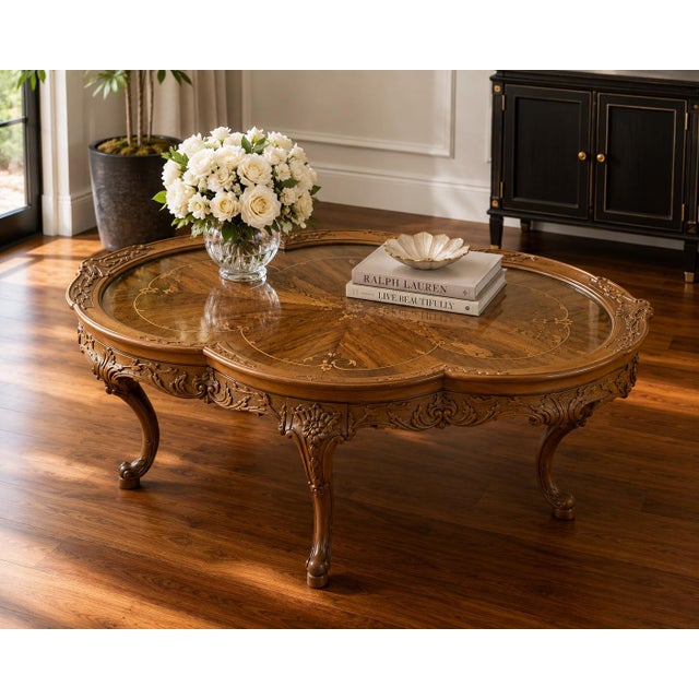Vintage Louis XV Revival style coffee table featuring an elegant quatrefoil silhouette, richly patterned walnut veneer,...