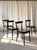 An elegant set of four wooden dining chairs featuring Werner Max Moser's iconic 1-250 design, originally introduced in...