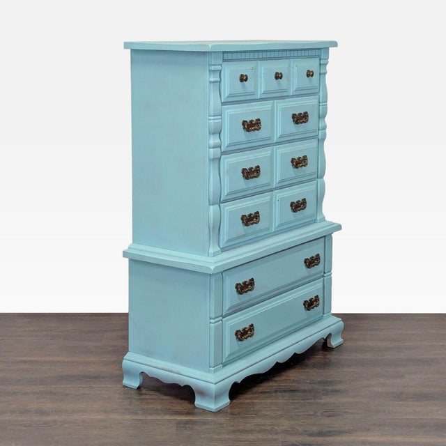 This Sumter dresser features a stylish light blue finish and classic brass handles. With six spacious drawers, it offers...