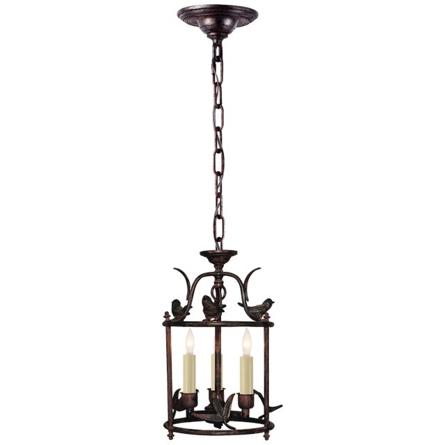 Diego Petite Classical Perching Bird Lantern in Rust with Verdis Accent Designer: Chapman & Myers Canopy: 5" Round...