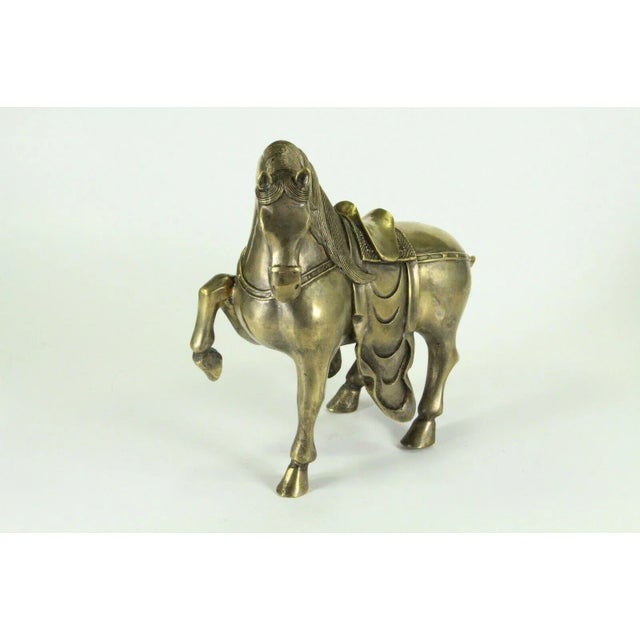 A very beautiful antique Chinese figurine of a horse Cast brass, hollow inside, with extremely well done details in...